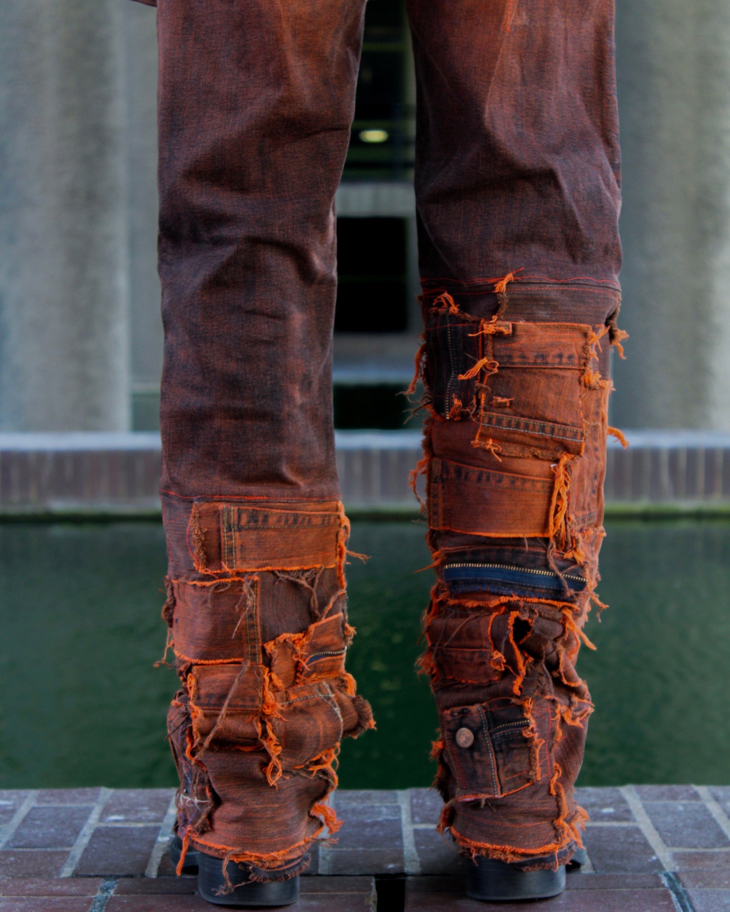 ASYMMETRICAL WAXED PANEL JEANS