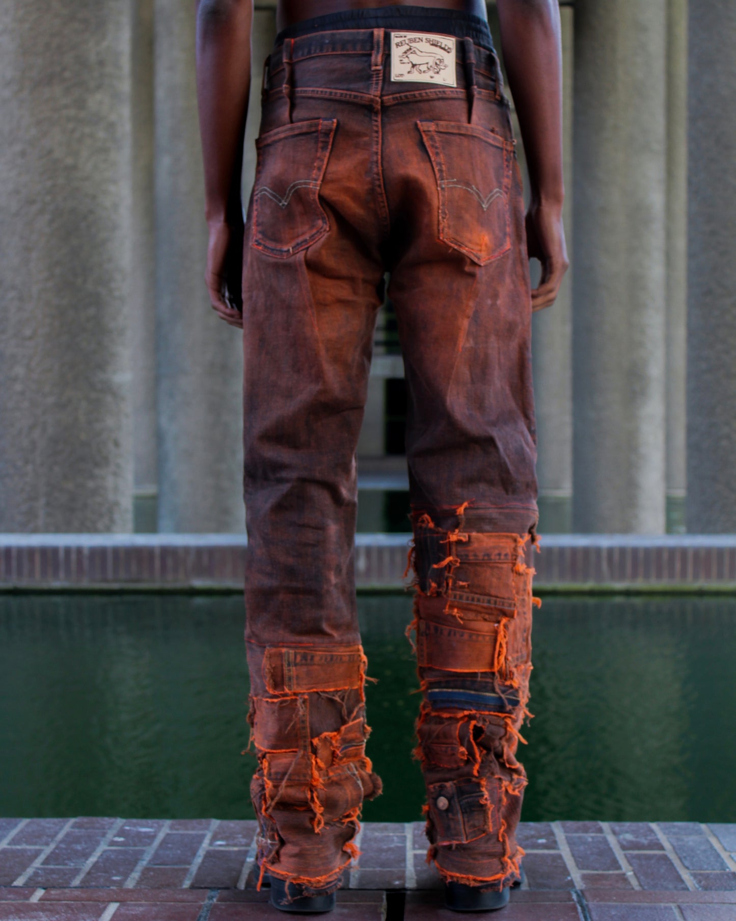 ASYMMETRICAL WAXED PANEL JEANS