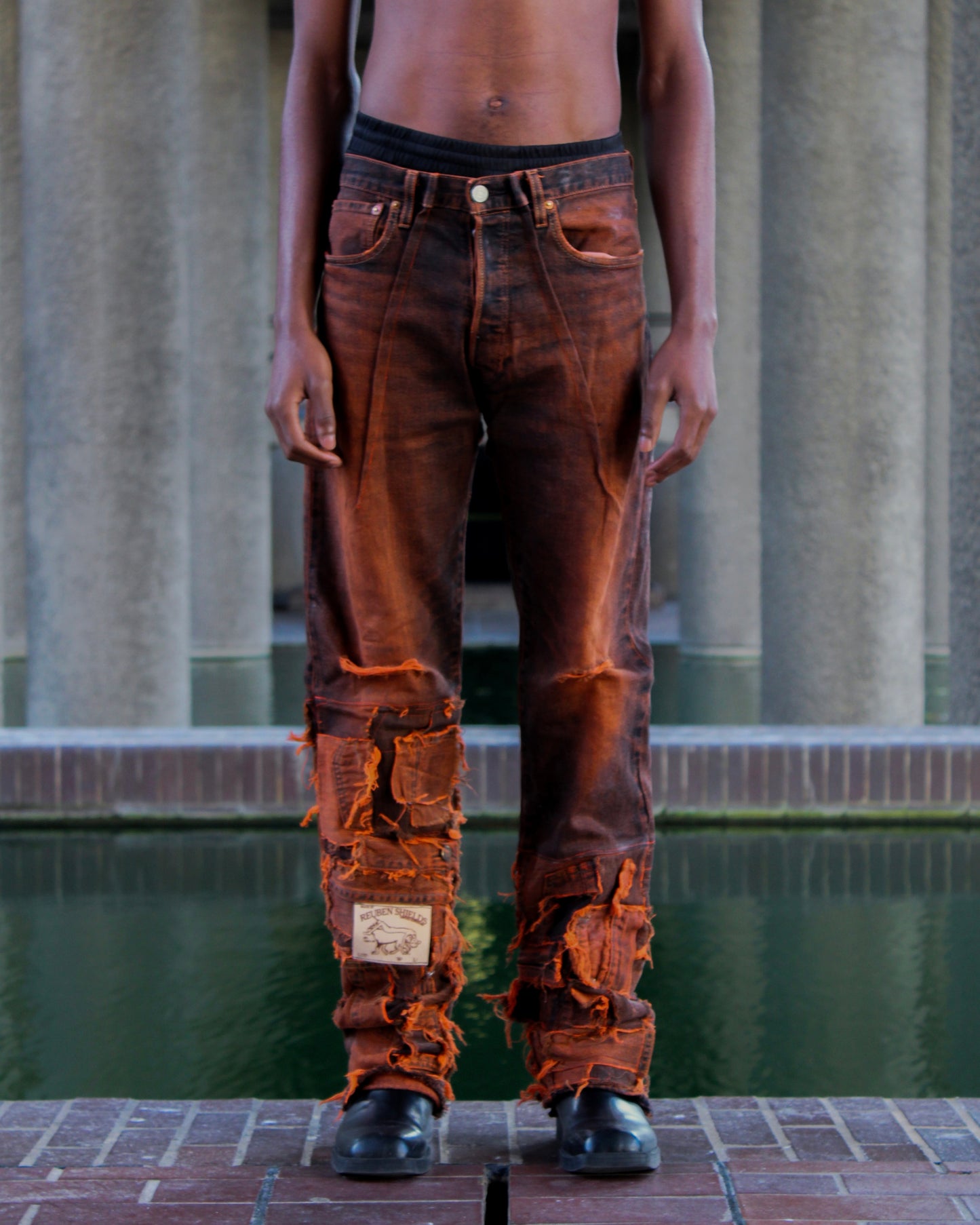 ASYMMETRICAL WAXED PANEL JEANS